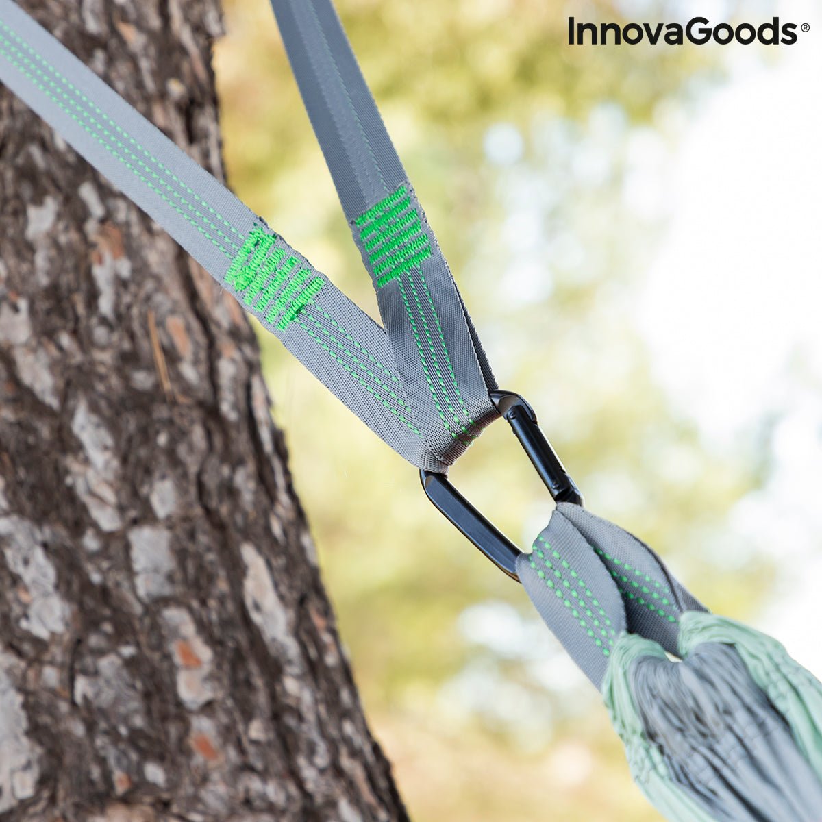 Close-up of the Double Camping Hammock securely fastened to a tree using a heavy-duty strap and carabiner showing durabiliy